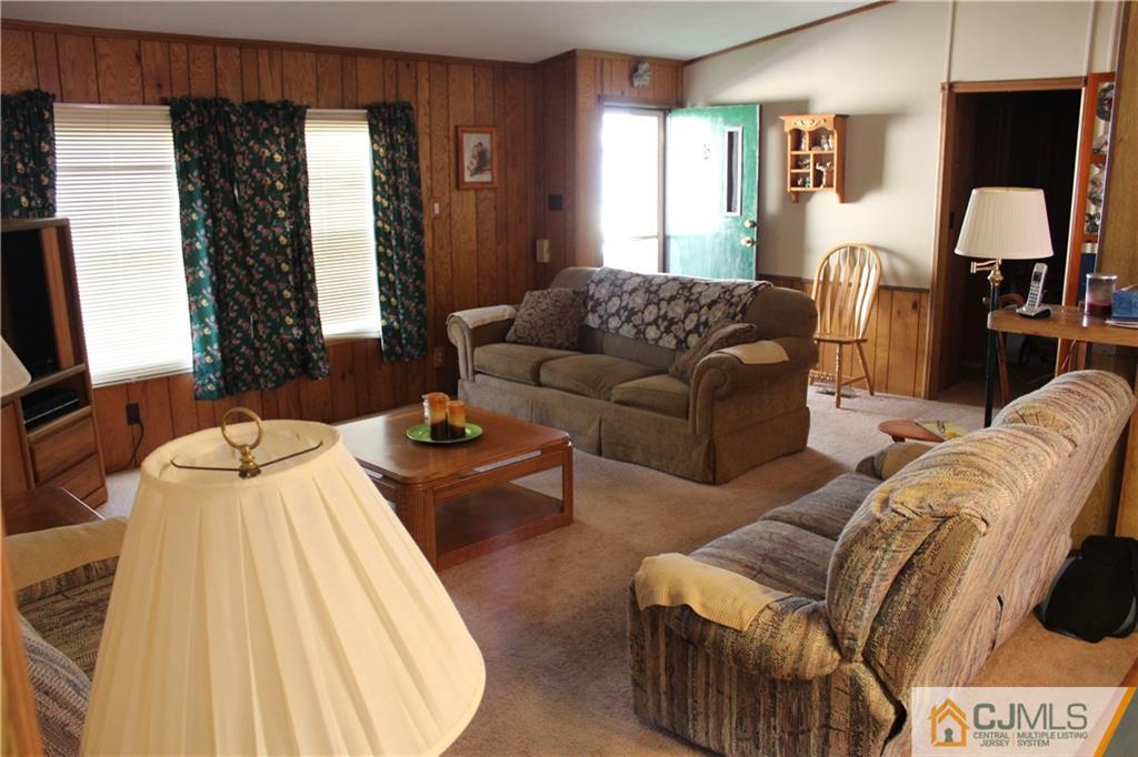 5 Poe Road North Brunswick, NJ 08902 - Photo 6 of 10 a spacious bedroom with a bed window and couch