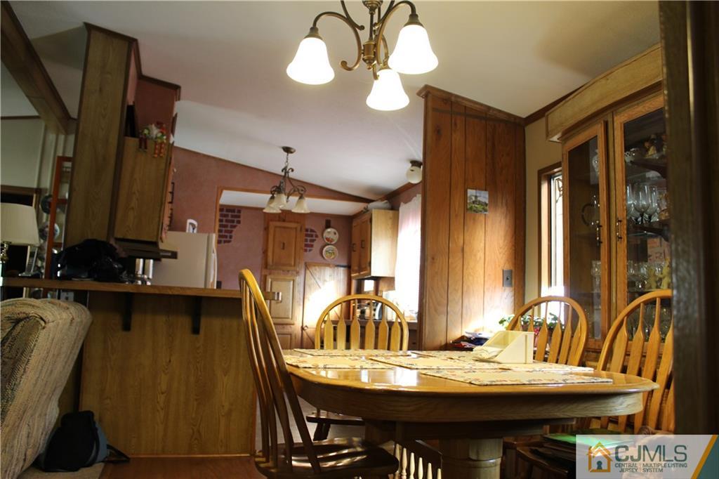 5 Poe Road North Brunswick, NJ 08902 - Photo 9 of 10 a view of a dining room with furniture and chandelier