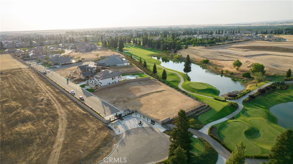 2490 East Copper Ridge Drive Fresno, CA 93730 - Photo 12 of 20 an aerial view of a house with a yard and lake view