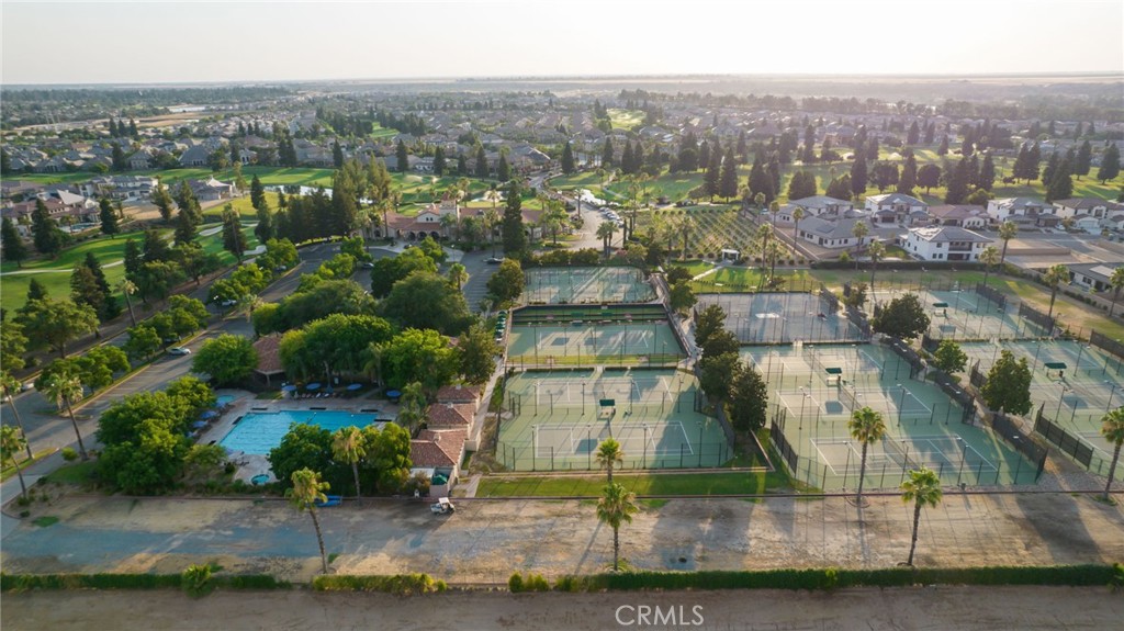 2490 East Copper Ridge Drive Fresno, CA 93730 - Photo 18 of 20 an aerial view of residential houses with outdoor space and swimming pool