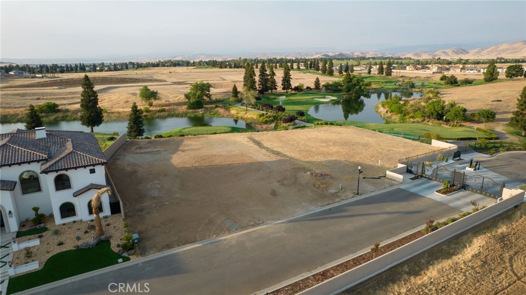 2490 East Copper Ridge Drive Fresno, CA 93730 - Photo 6 of 20 a view of a lake with houses