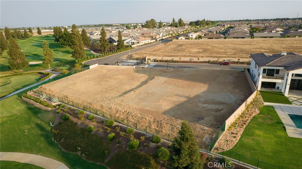 2490 East Copper Ridge Drive Fresno, CA 93730 - Photo 8 of 20 an aerial view of residential houses with outdoor space