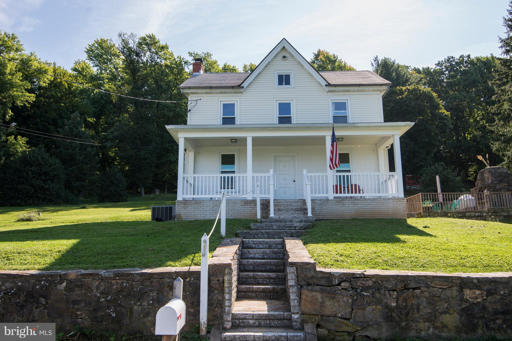 6227 Clevelandtown Road Boonsboro, MD 21713 - Photo 1 of 30 a front view of a house with garden
