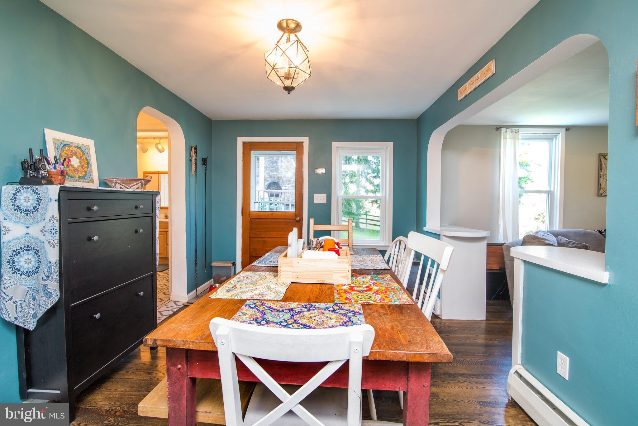 6227 Clevelandtown Road Boonsboro, MD 21713 - Photo 11 of 30 a view of a dining room with furniture window and wooden floor