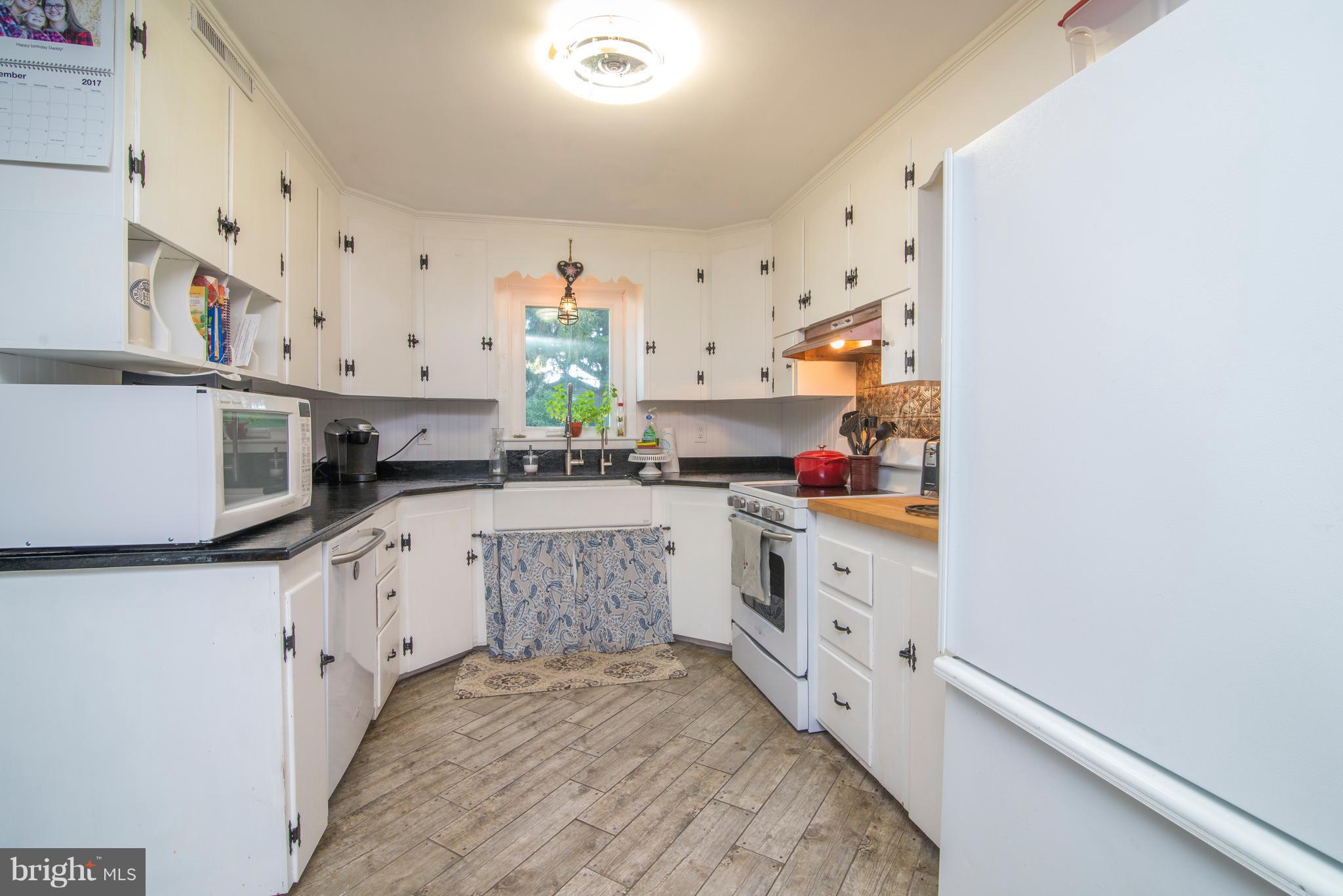 6227 Clevelandtown Road Boonsboro, MD 21713 - Photo 15 of 30 a kitchen with stainless steel appliances a sink stove and cabinets