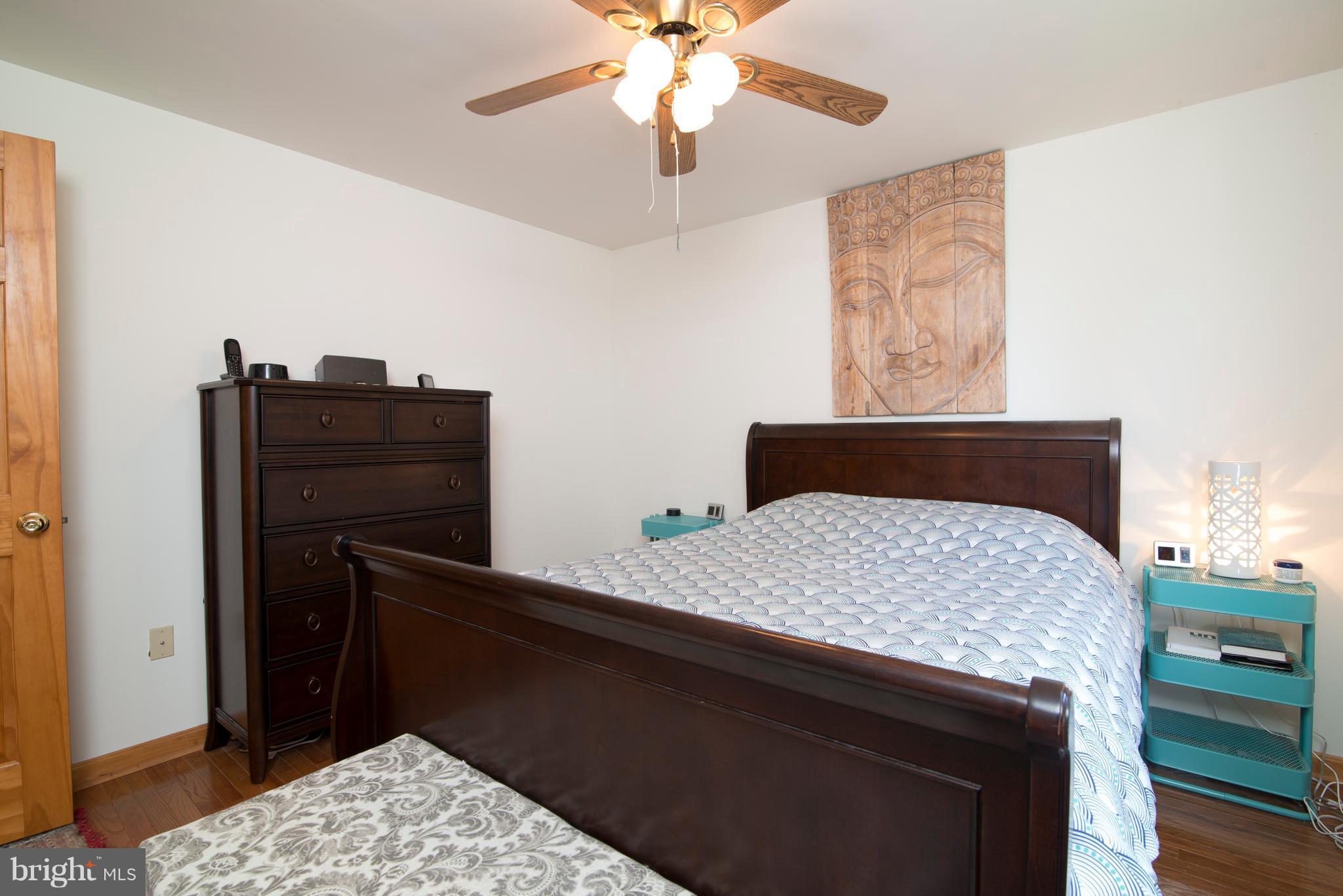 6227 Clevelandtown Road Boonsboro, MD 21713 - Photo 18 of 30 a bedroom with a bed and a dresser