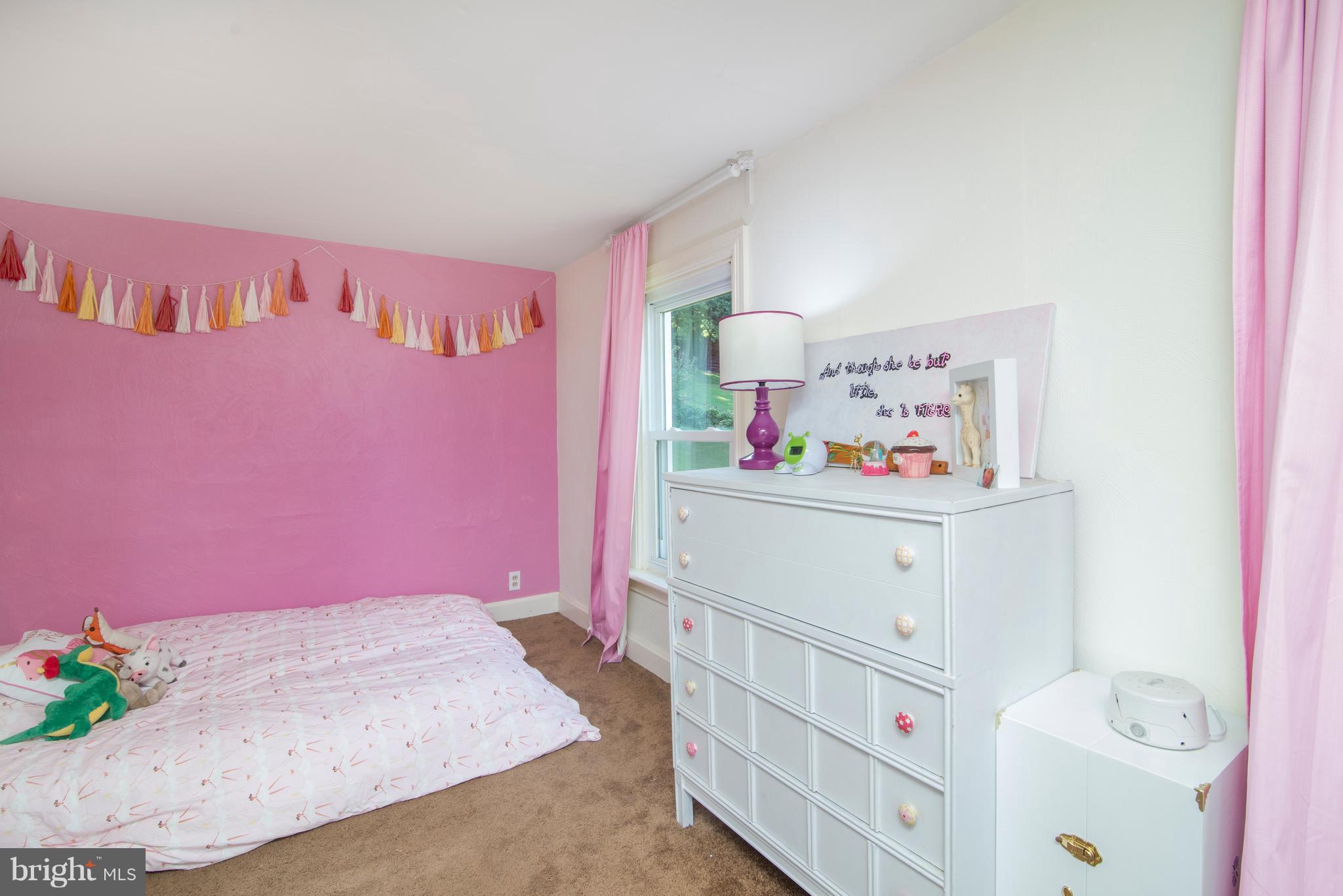 6227 Clevelandtown Road Boonsboro, MD 21713 - Photo 25 of 30 a bedroom with pink cabinets and bed