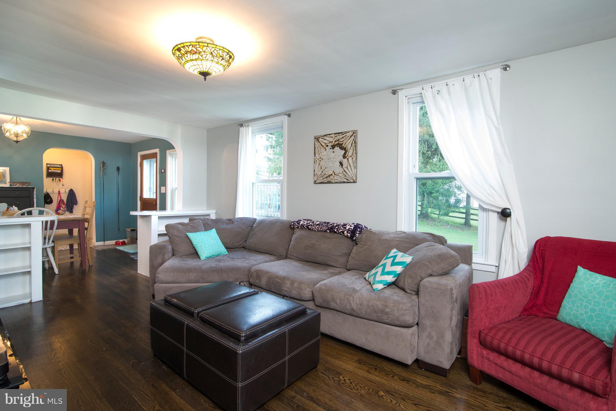 6227 Clevelandtown Road Boonsboro, MD 21713 - Photo 6 of 30 a living room with furniture and a wooden floor