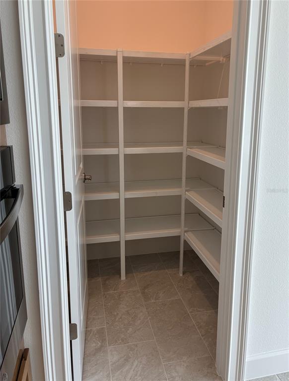4 Coronado Road Flagler Beach, FL 32136 - Photo 19 of 30 a view of walk in closet with empty racks