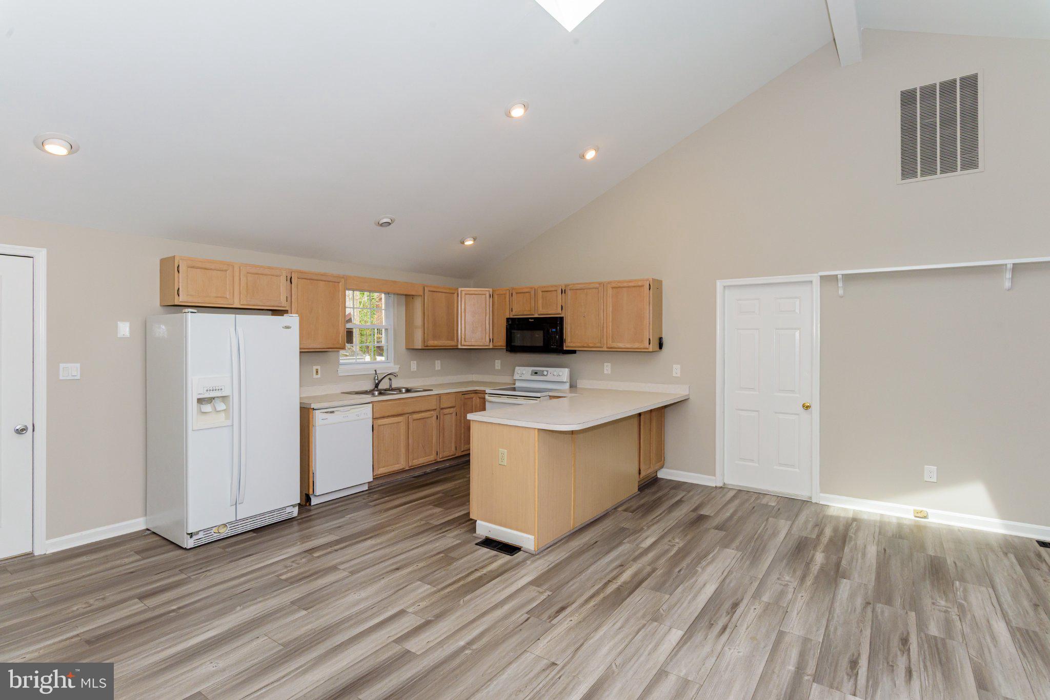 258 Ocean Parkway Berlin, MD 21811 - Photo 15 of 55 Bright and airy kitchen space with breakfast bar.