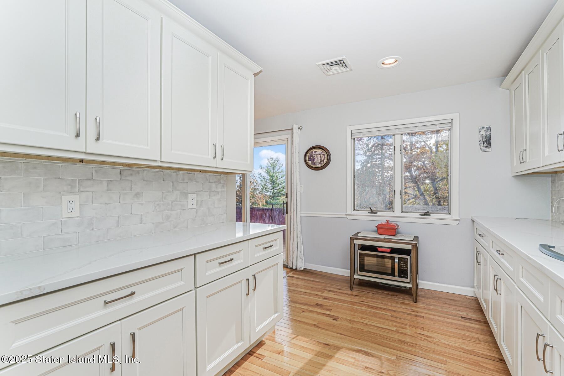 20 Signal Hill Road Staten Island, NY 10301 - Photo 15 of 42 a kitchen with cabinets and window