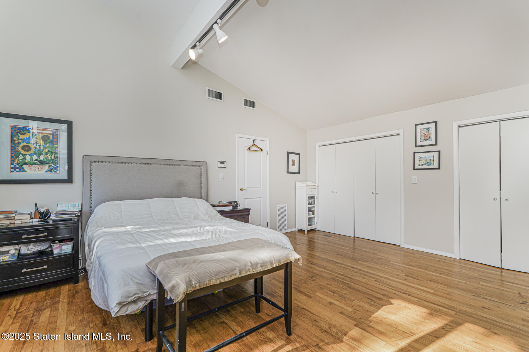 20 Signal Hill Road Staten Island, NY 10301 - Photo 23 of 42 a bedroom with a bed and a table in it