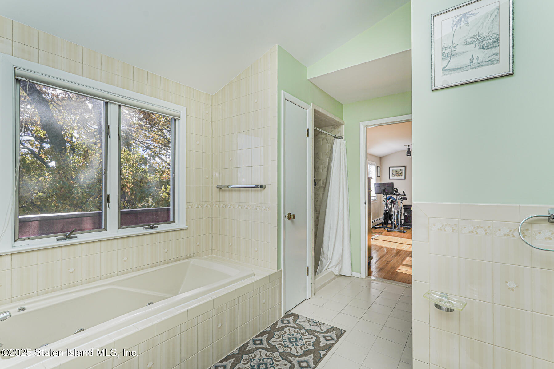20 Signal Hill Road Staten Island, NY 10301 - Photo 25 of 42 a bathroom with a bathtub and a shower