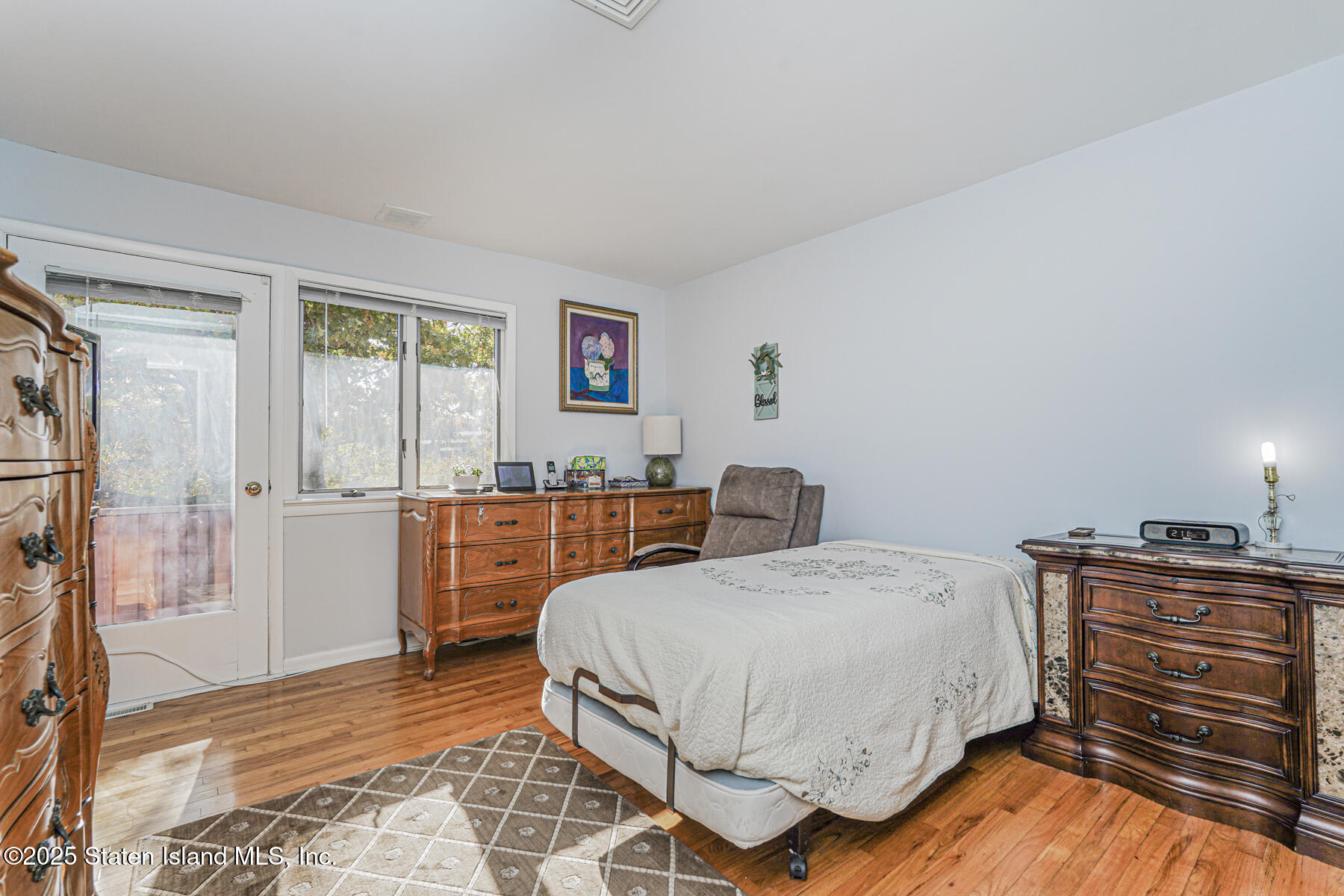 20 Signal Hill Road Staten Island, NY 10301 - Photo 30 of 42 a bedroom with a bed and a cabinets