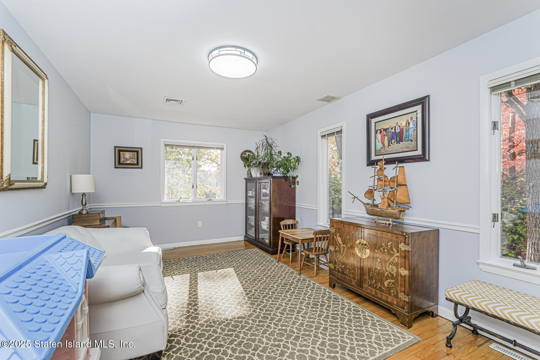 20 Signal Hill Road Staten Island, NY 10301 - Photo 32 of 42 a living room with furniture and wooden floor