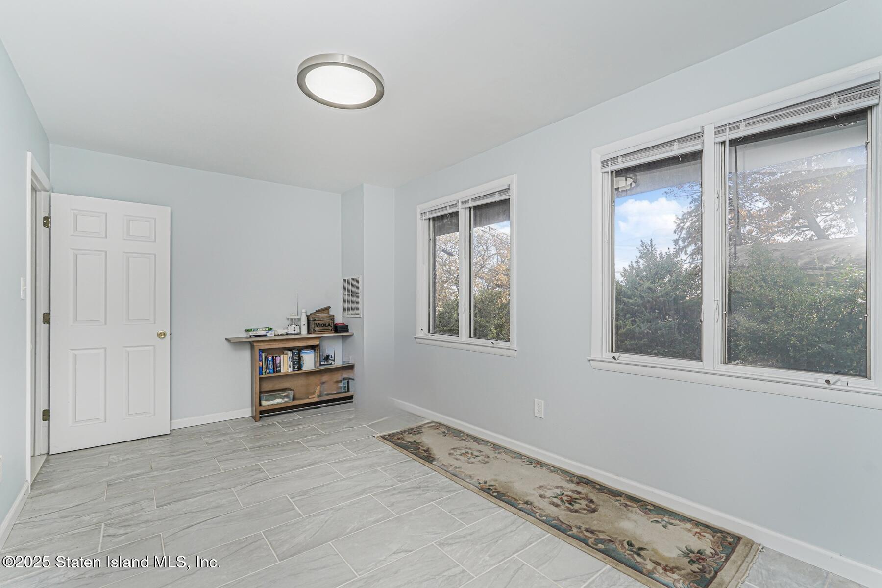 20 Signal Hill Road Staten Island, NY 10301 - Photo 33 of 42 a view of room with window and furniture