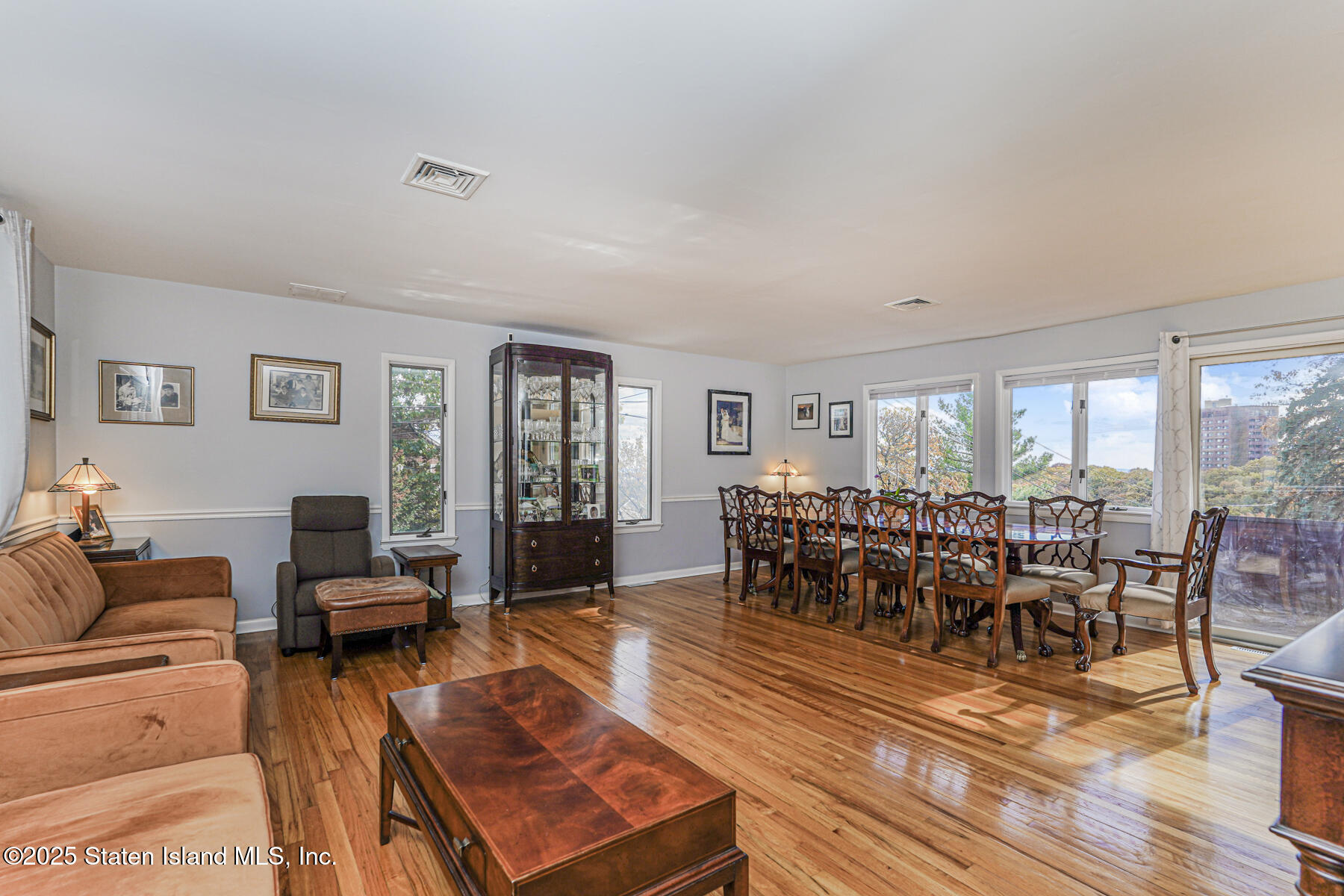 20 Signal Hill Road Staten Island, NY 10301 - Photo 5 of 42 a living room with furniture dining table and a large window