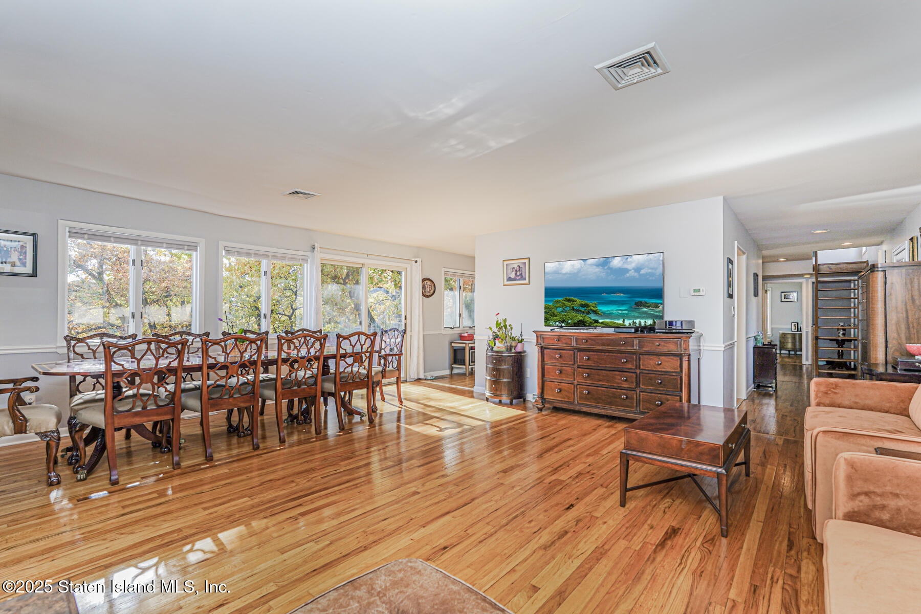 20 Signal Hill Road Staten Island, NY 10301 - Photo 6 of 42 a living room with furniture dining room and wooden floor