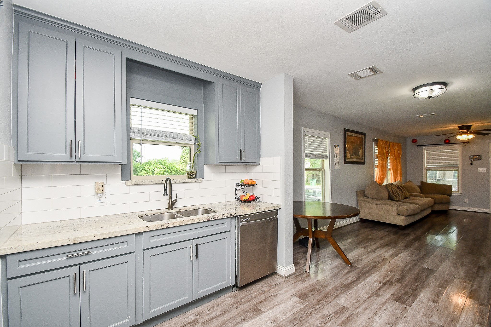 1607 Sylvester Road Houston, TX 77009 - Photo 15 of 32 a kitchen with sink and cabinets
