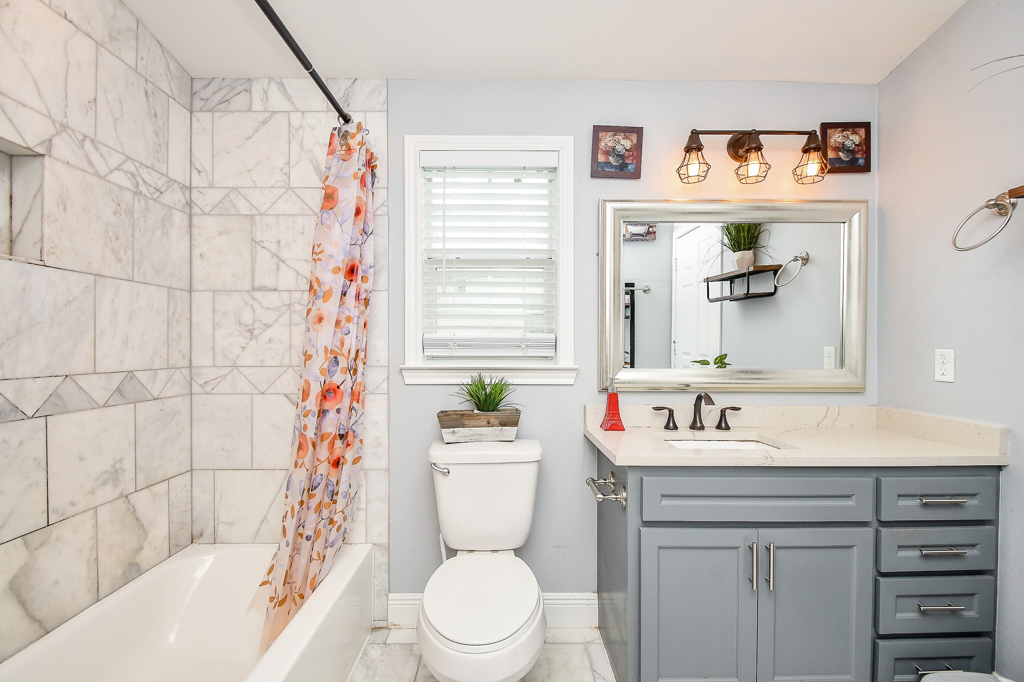 1607 Sylvester Road Houston, TX 77009 - Photo 21 of 32 a bathroom with a sink toilet and shower
