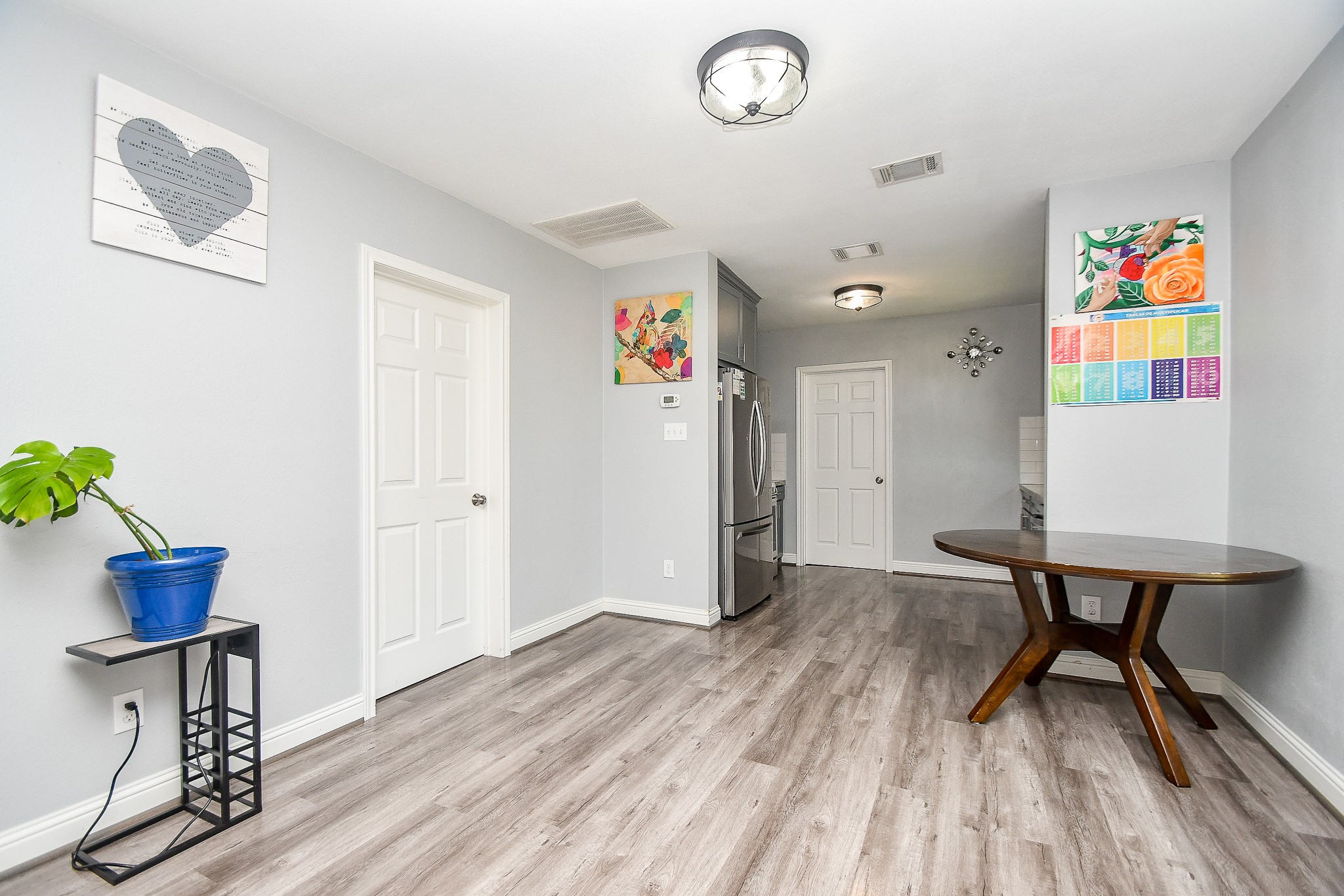 1607 Sylvester Road Houston, TX 77009 - Photo 8 of 32 a view of kitchen with furniture and wooden floor