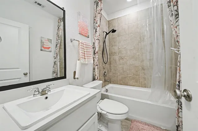 a bathroom with a sink a toilet and a bathtub