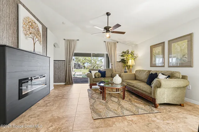 a living room with furniture and a large window