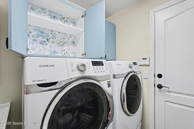 a view of washer and dryer in a utility room