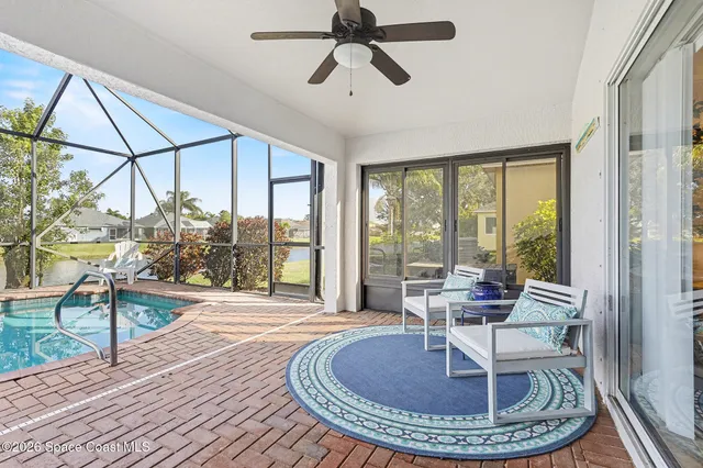 a view of a livingroom with furniture wooden floor a chandelier
