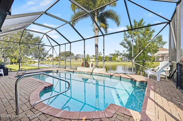 a view of a swimming pool with a patio