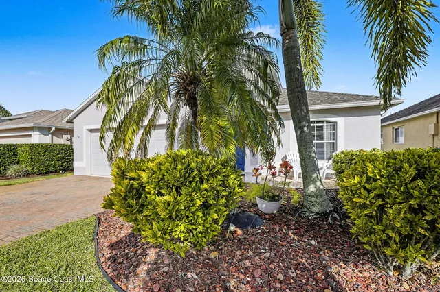 front view of a house with a garden