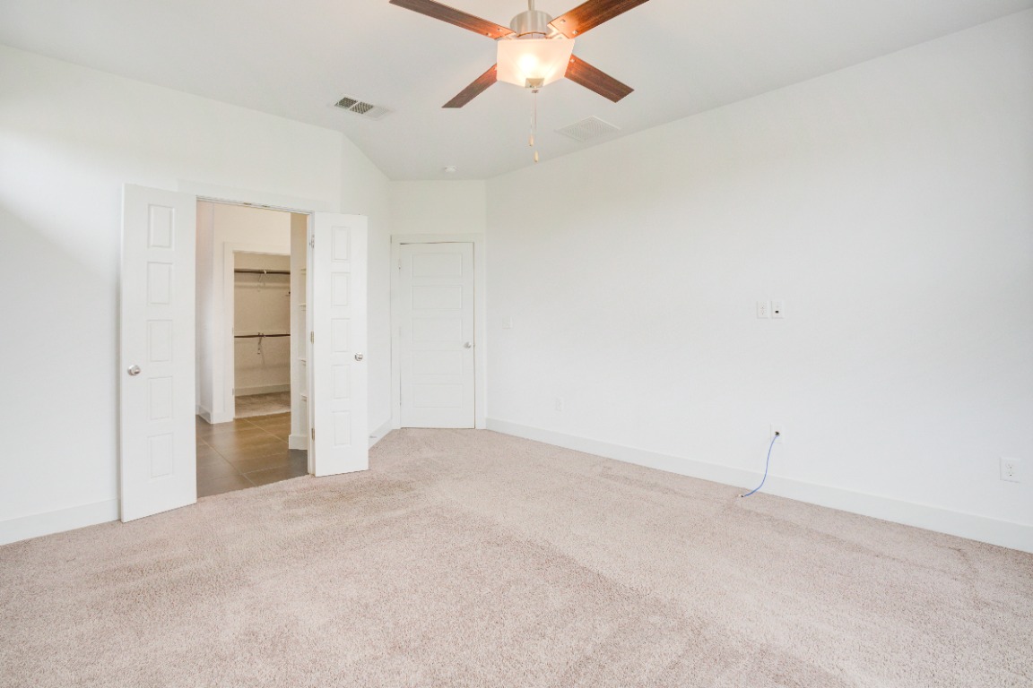 5910 Rubicon Run Austin, TX 78745 - Photo 11 of 18 Unfurnished bedroom featuring carpet flooring and a ceiling fan