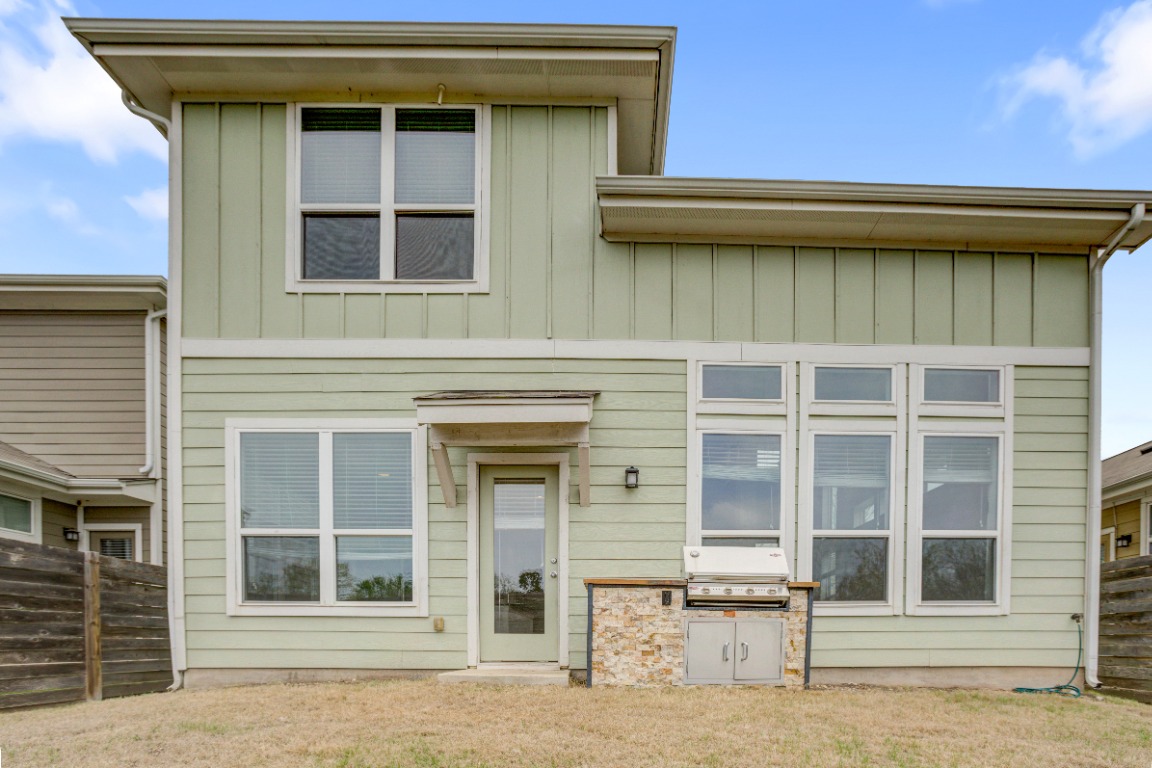 5910 Rubicon Run Austin, TX 78745 - Photo 18 of 18 Rear view of property featuring board and batten siding