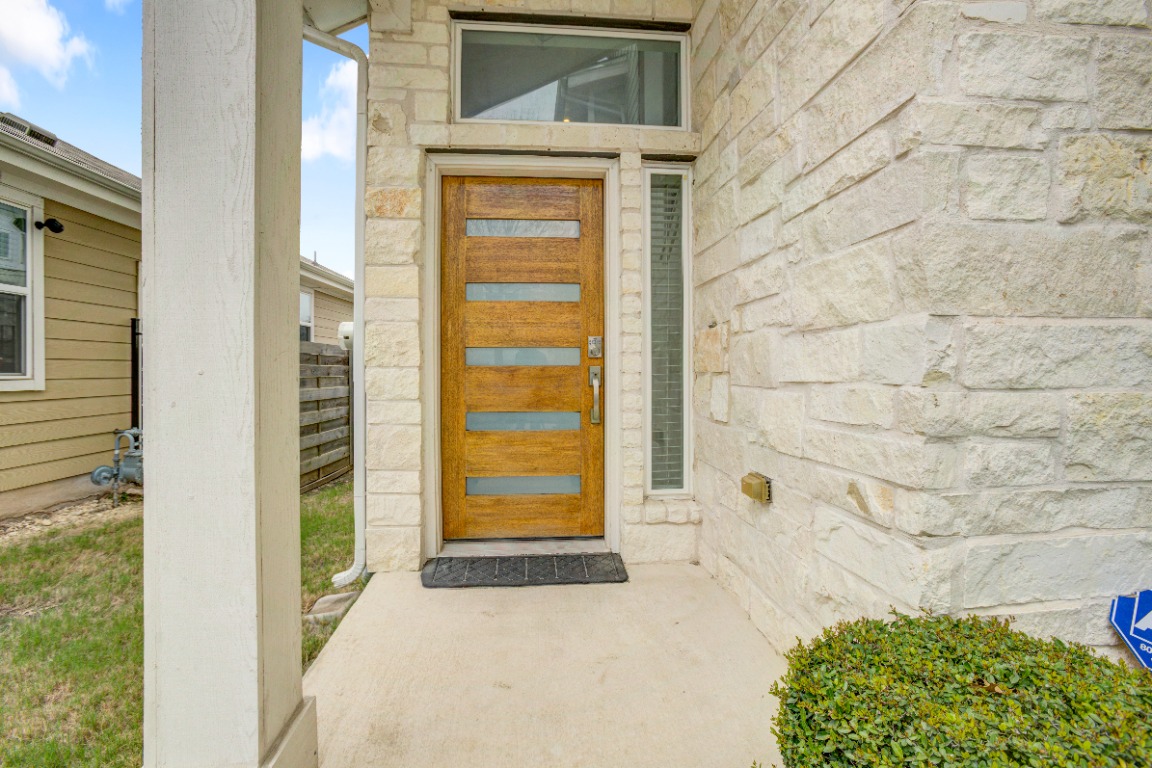 5910 Rubicon Run Austin, TX 78745 - Photo 2 of 18 Entrance to property with stone siding