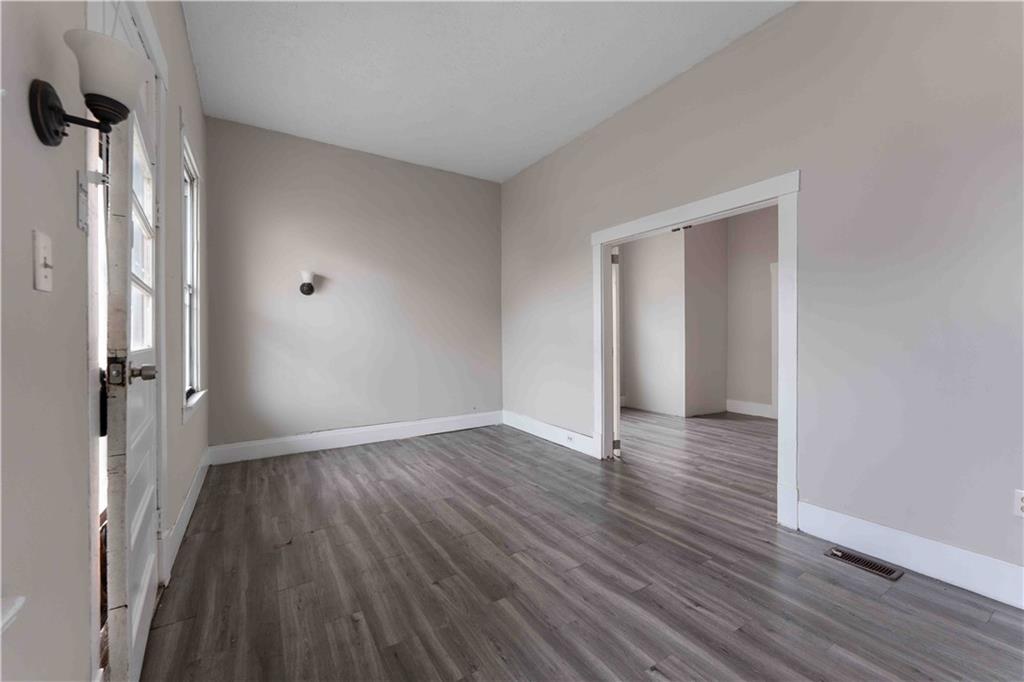 254-256 Pennsylvania Avenue Rochester, PA 15074 - Photo 14 of 32 wooden floor in an empty room