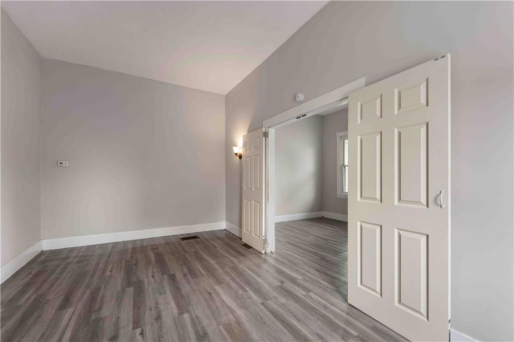 254-256 Pennsylvania Avenue Rochester, PA 15074 - Photo 21 of 32 wooden floor in an empty room