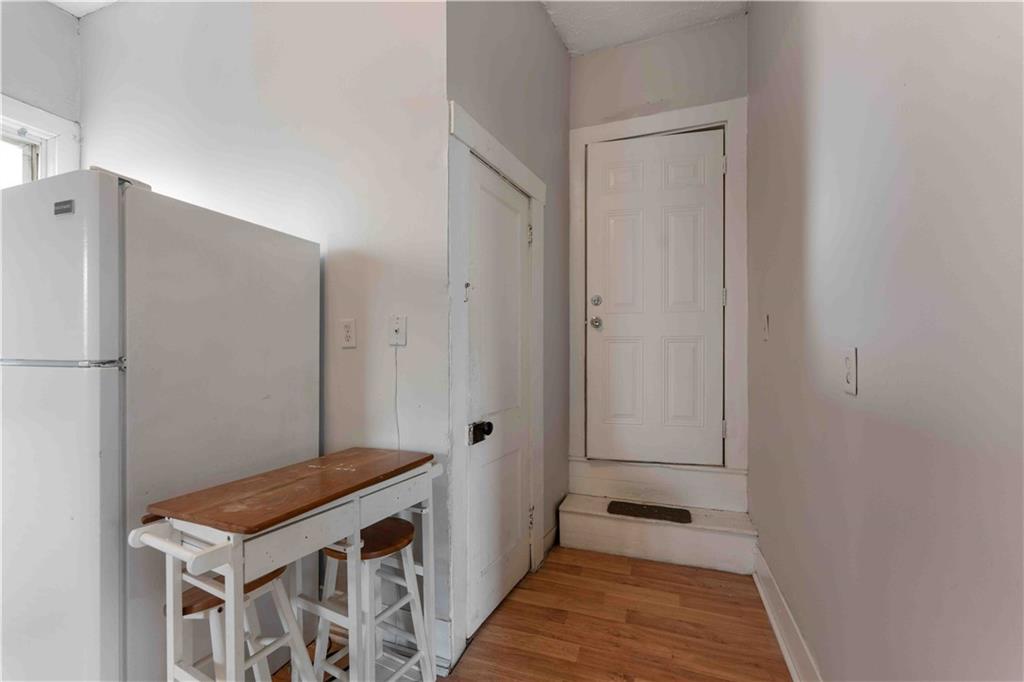 254-256 Pennsylvania Avenue Rochester, PA 15074 - Photo 26 of 32 a view of a room with wooden floor and staircase