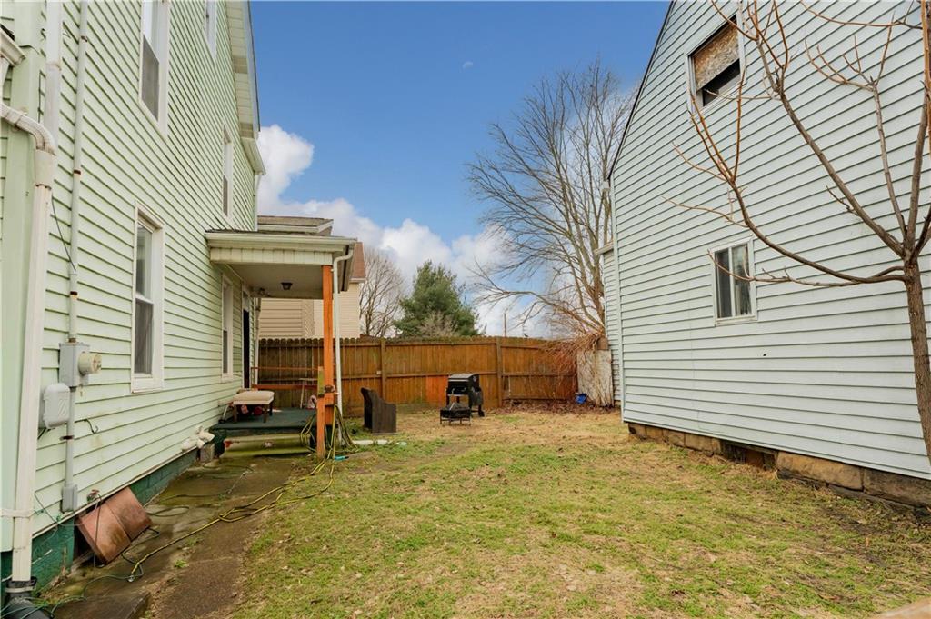 254-256 Pennsylvania Avenue Rochester, PA 15074 - Photo 31 of 32 a backyard of a house with table and chairs