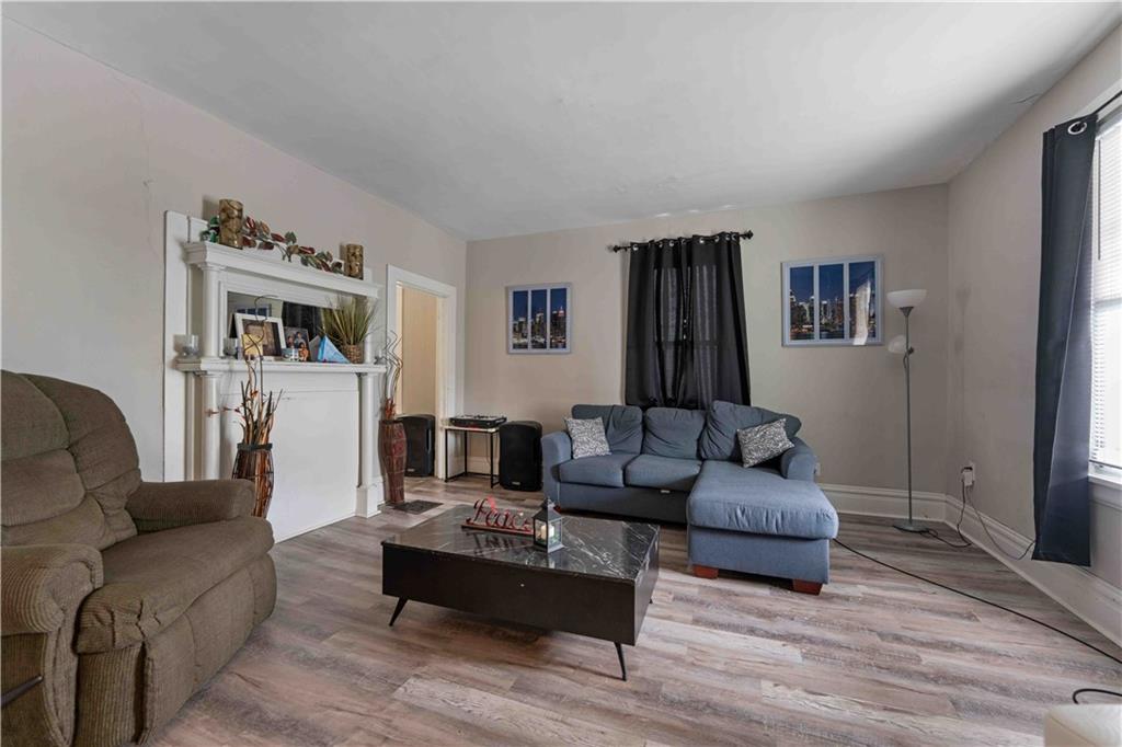 254-256 Pennsylvania Avenue Rochester, PA 15074 - Photo 5 of 32 a living room with furniture and a flat screen tv