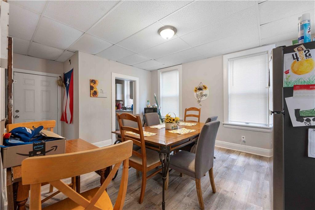 254-256 Pennsylvania Avenue Rochester, PA 15074 - Photo 10 of 32 a view of a dining room with furniture and a window