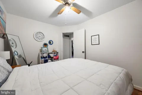 a bed room with a bed and a chandelier