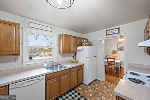 a kitchen with a sink appliances and cabinets