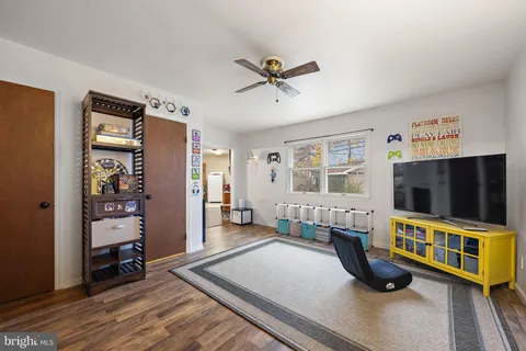 a bedroom with furniture and a flat screen tv