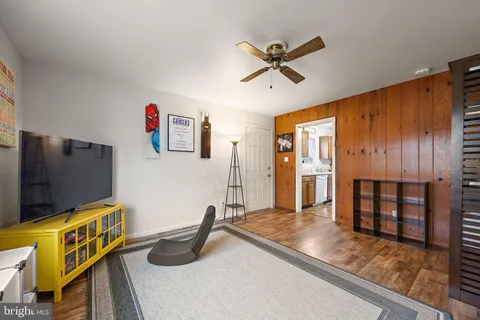a view of a livingroom with furniture and gym equipment