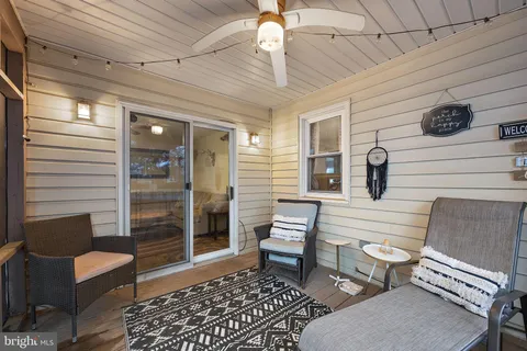 a view of a two chairs in the balcony