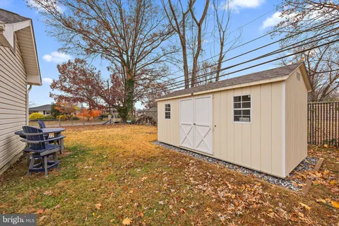 a view of a patio with chair and a fire pit