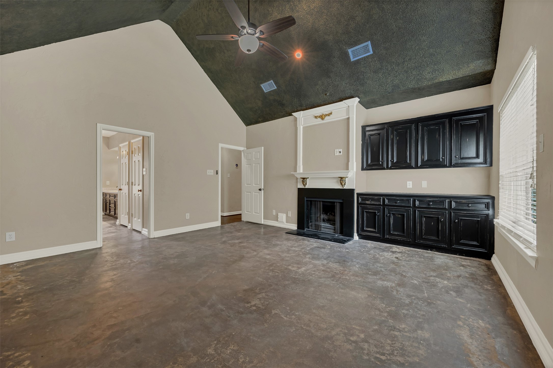 7659 Ameswood Road Houston, TX 77095 - Photo 12 of 24 a view of kitchen with furniture and fireplace