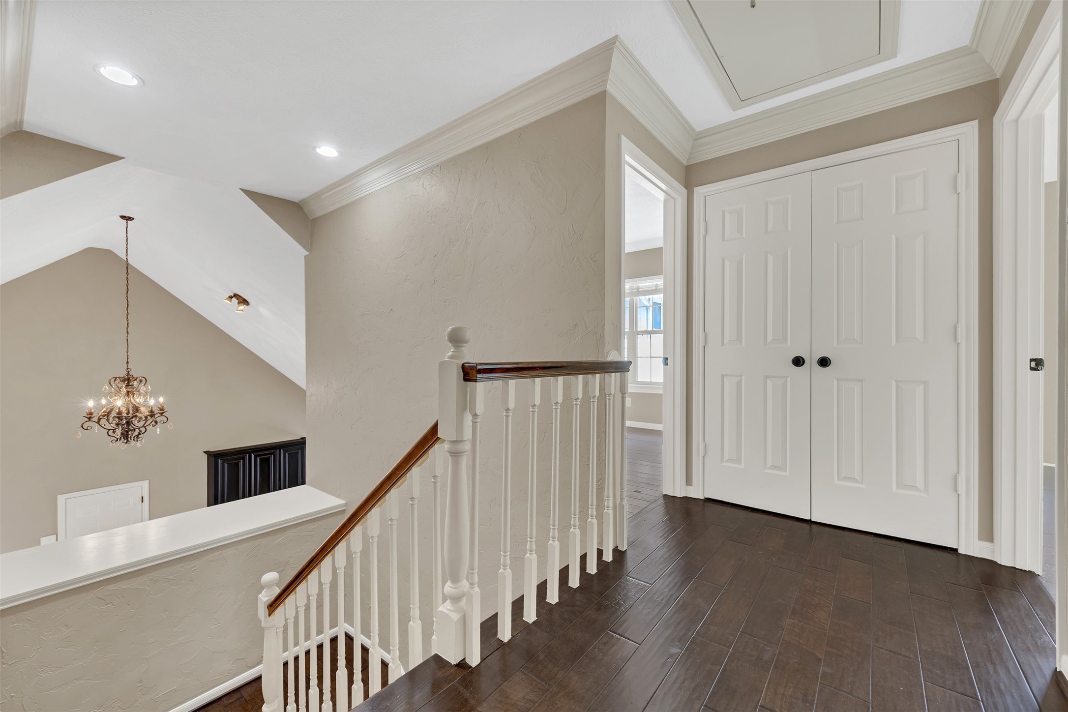 7659 Ameswood Road Houston, TX 77095 - Photo 16 of 24 a view of a hallway with entryway wooden floor and front door