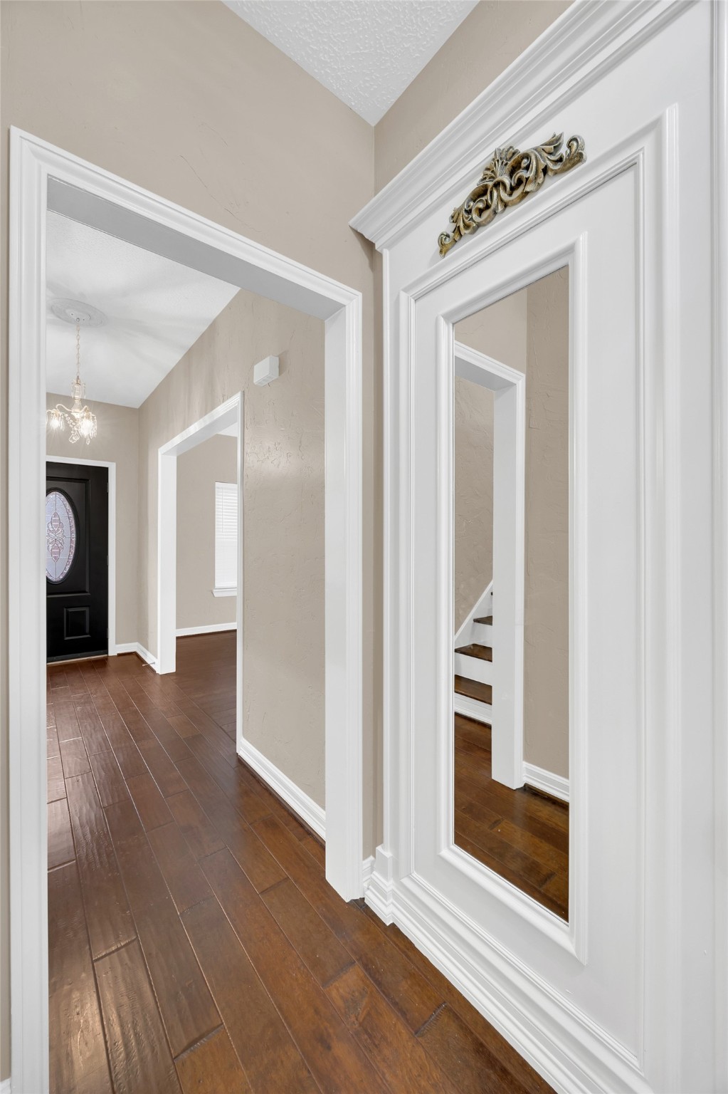 7659 Ameswood Road Houston, TX 77095 - Photo 3 of 24 a view of a hallway with wooden floor