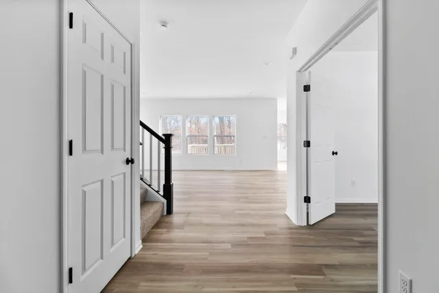 a kitchen with granite countertop a sink stove and cabinets